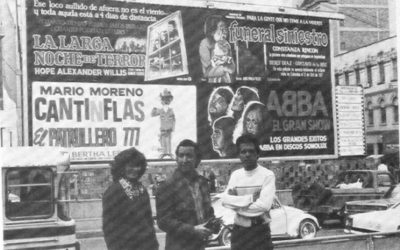 Jairo Pinilla and others standing in front of Funeral Siniestro Billboard in the 1970's